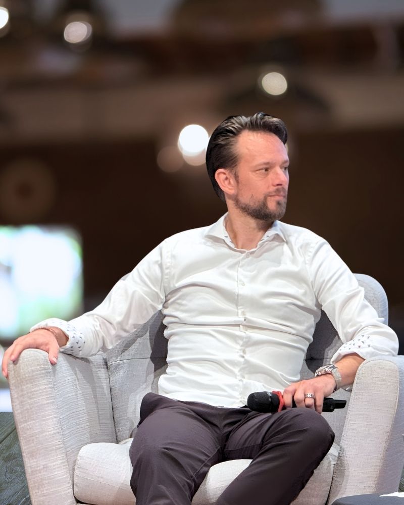 Martin Gents speaking on stage